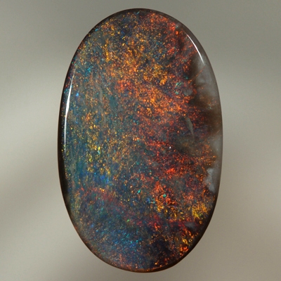 SOLID BLACK OPAL Burning red over a blue background